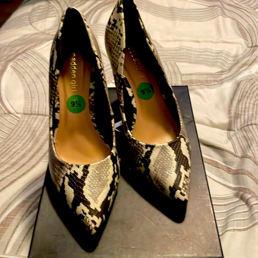 Brown and white snake print shoes. Heels are 4 inches. Never been worn